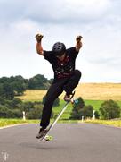 A picture of David Buchmann performing "Longboard Dancing & Freestyle" by Tabea Flatten