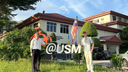 Zwei Austauschstudierende vor der USM