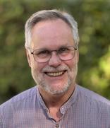 A man with glasses and beard
