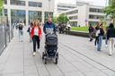 family with pushchair on campus