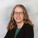 Das Bild zeigt eine Frau mit Brille und langen Haaren